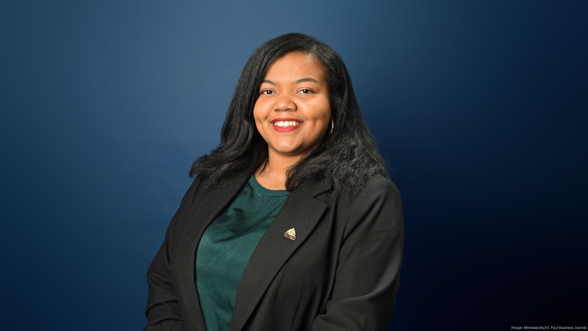 Councilwoman Cheniqua Johnson portrait in front of a blue background.