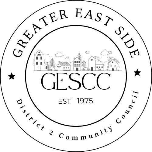 Circular logo for Greater East Side District 2 Community Council with illustrated buildings and trees, and text “GESCC EST 1975” in the center.