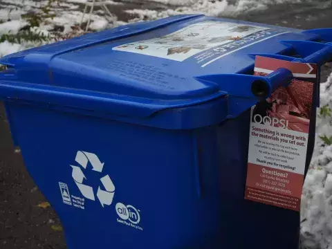 image of recycling cart with red tag hanging on the handle