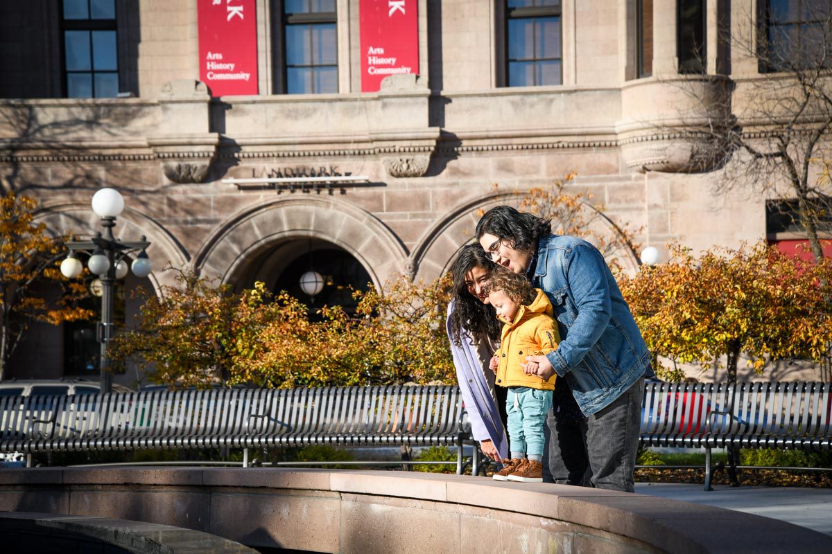Saint Paul family visits Rice Park with child