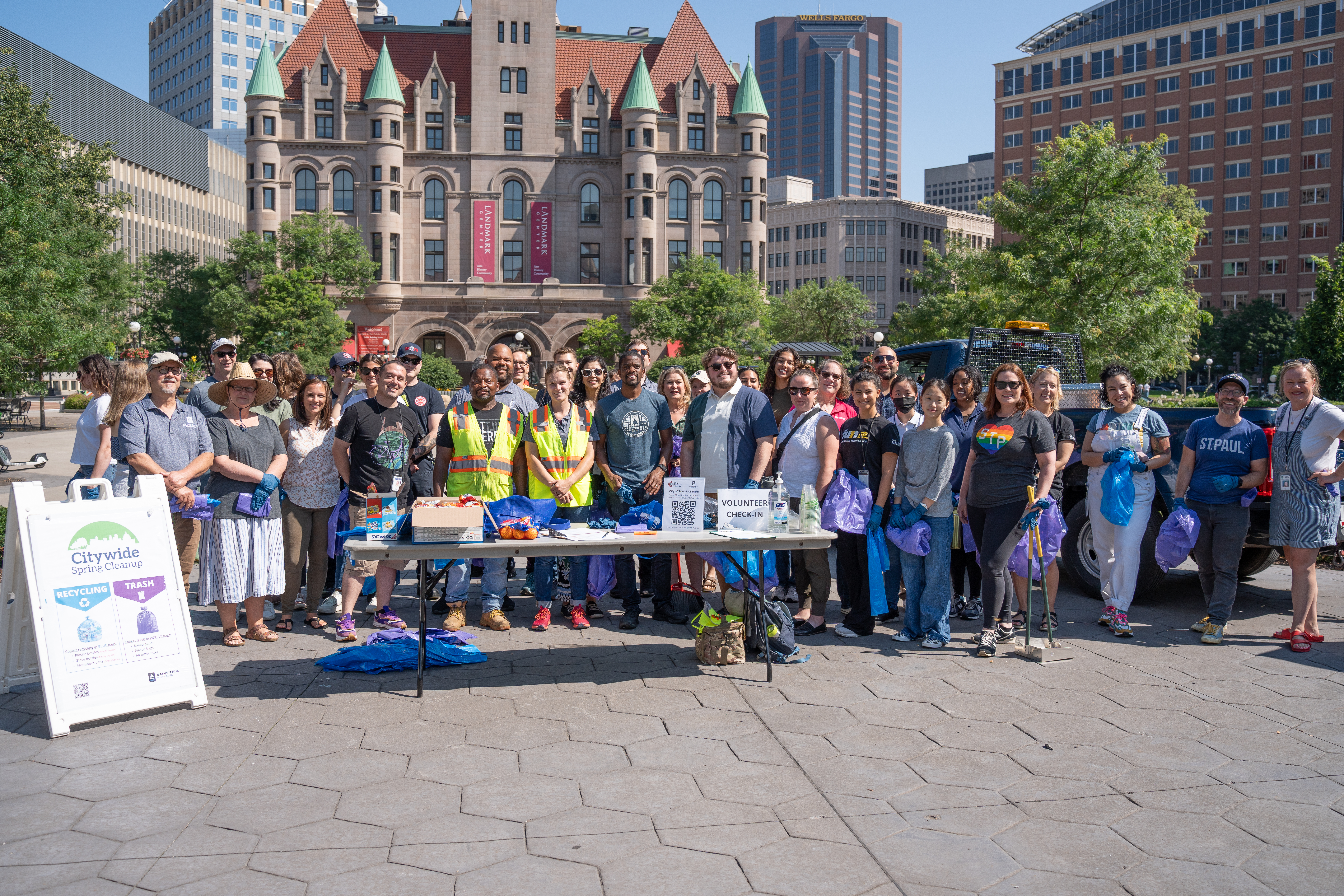 City of Saint Paul employees pose for a photo during a clean up event in Rice Park