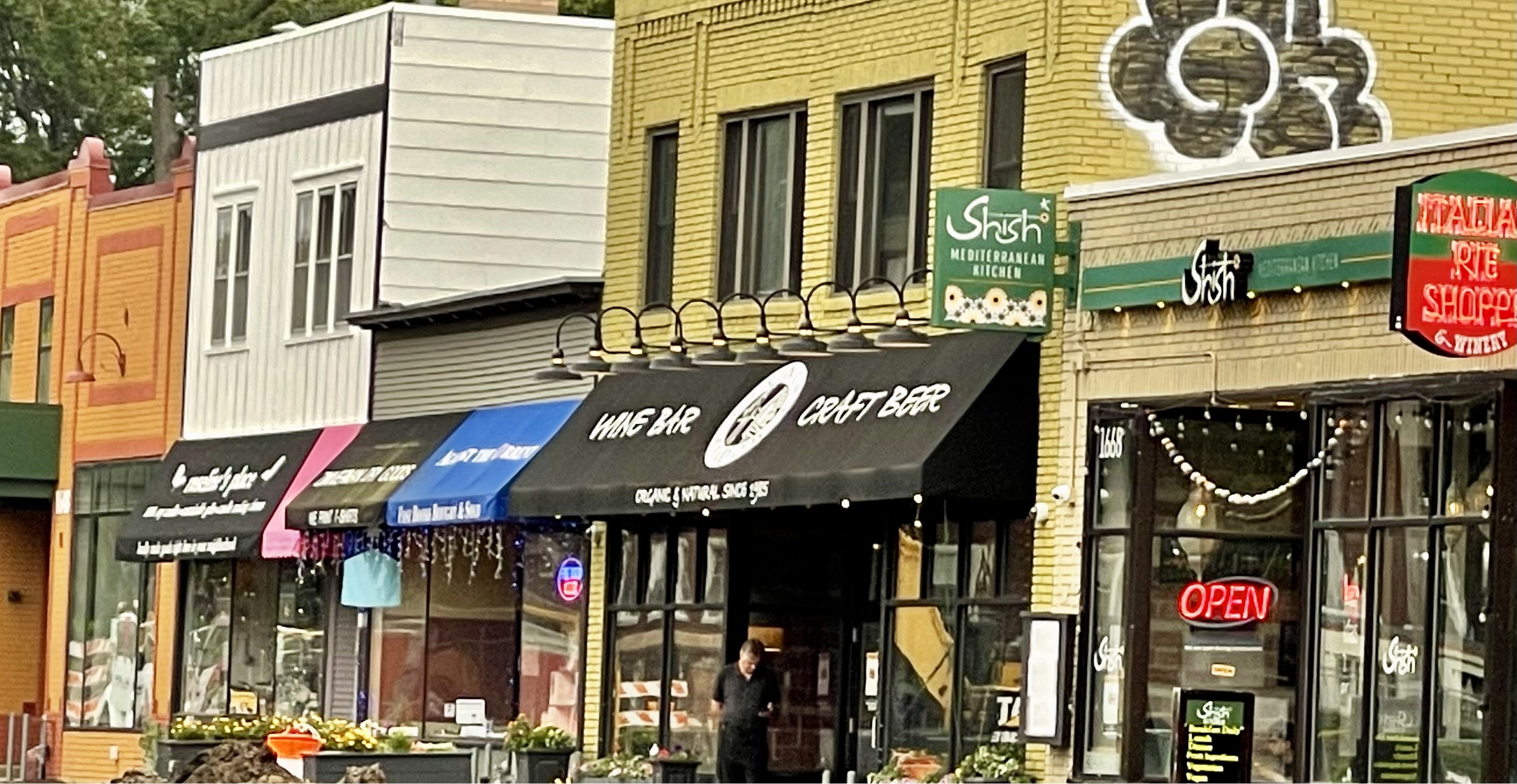 a photo taken of store fronts on Grand avenue