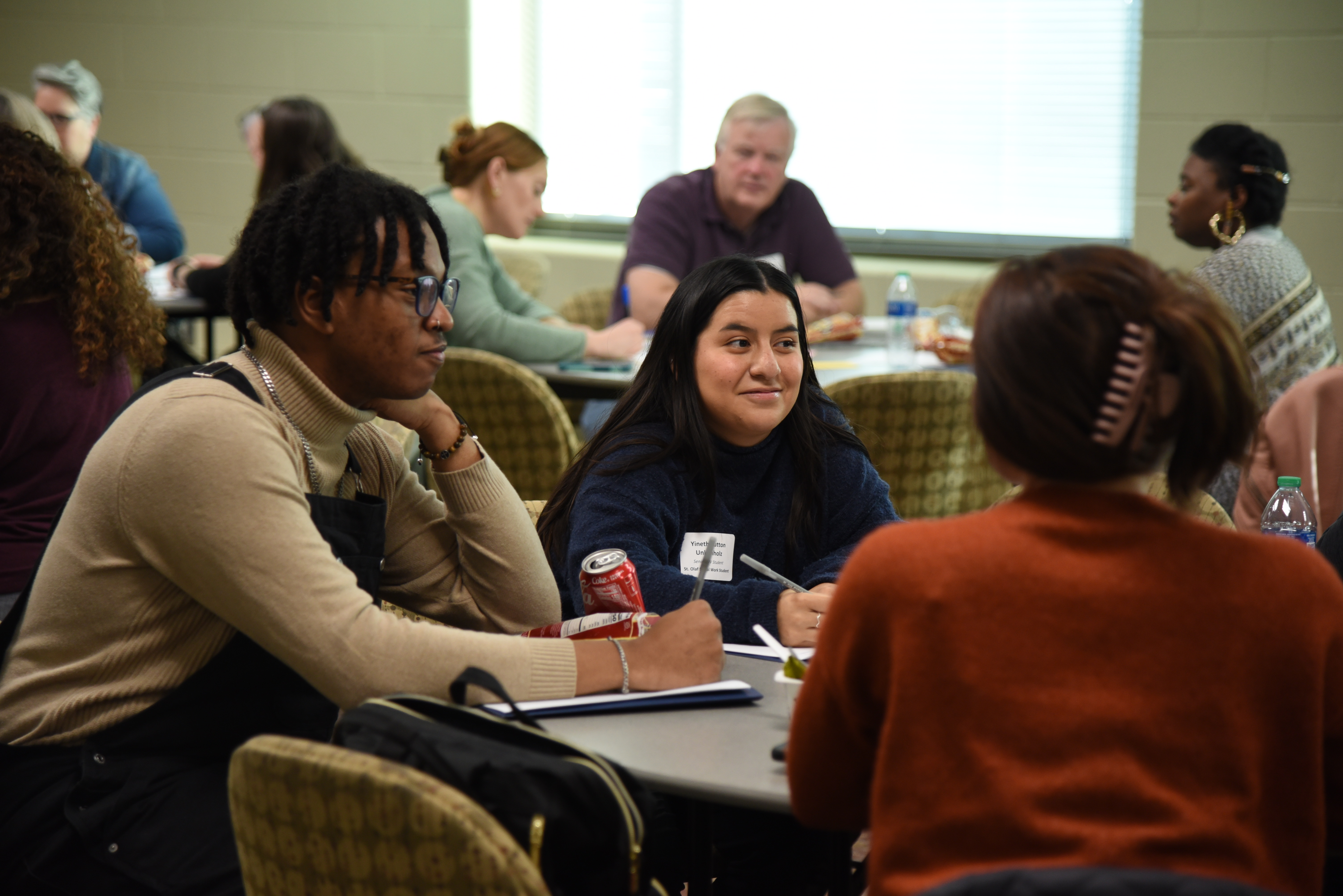 community members having a discussion at a table
