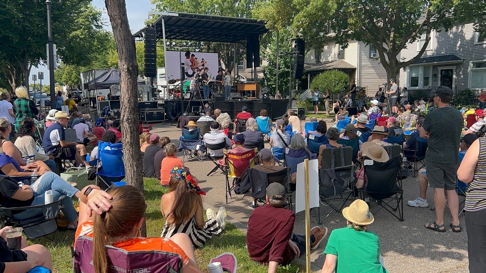 Crowd watches a jazz band perform on the outdoor stage at the Selby Avenue Jazz Festival.