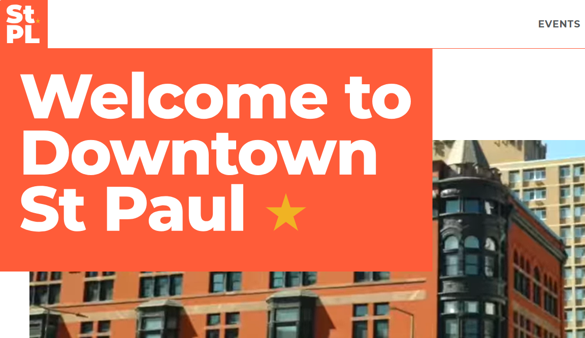 Screenshot of Downtown Saint Paul website hero with "Welcome to Downtown St Paul" headline over a photo of historic red-brick downtown buildings.