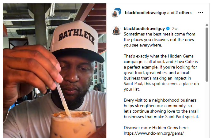 Screenshot of an Instagram post by @blackfoodietravelguy promoting the Hidden Gems campaign and Flava Cafe in Saint Paul, with a video thumbnail of a person holding an iced chai tea.