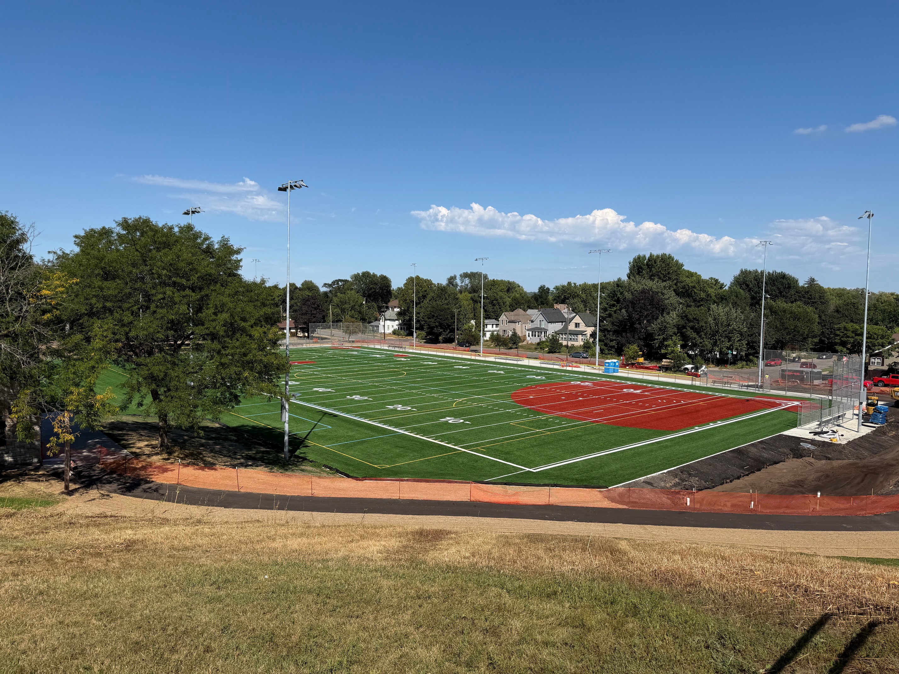 View of artificial turf athletic fields from a hill. 