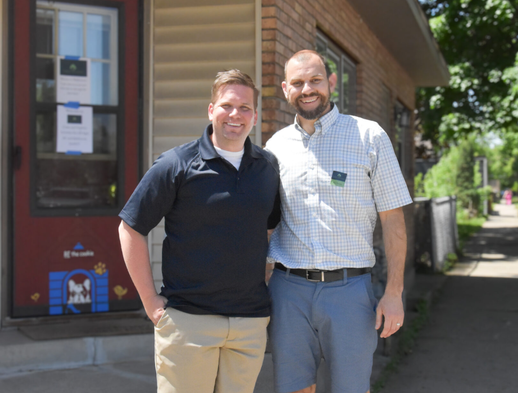 Business owners pose for a photo in the Como, Front, Dale Commercial Corridor