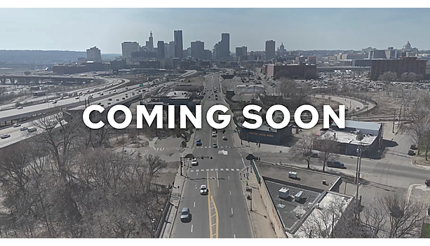 "Coming Soon" graphic over an aerial view of an East Side Saint Paul arterial crossing I-94, with the downtown skyline and State Capitol on the horizon.