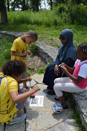 Youth learning about the water cycle at the Classroom