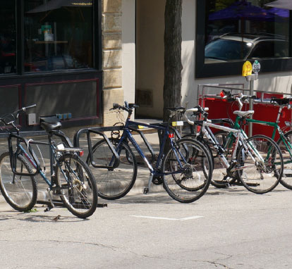 Parked bicycles in front of a retail store