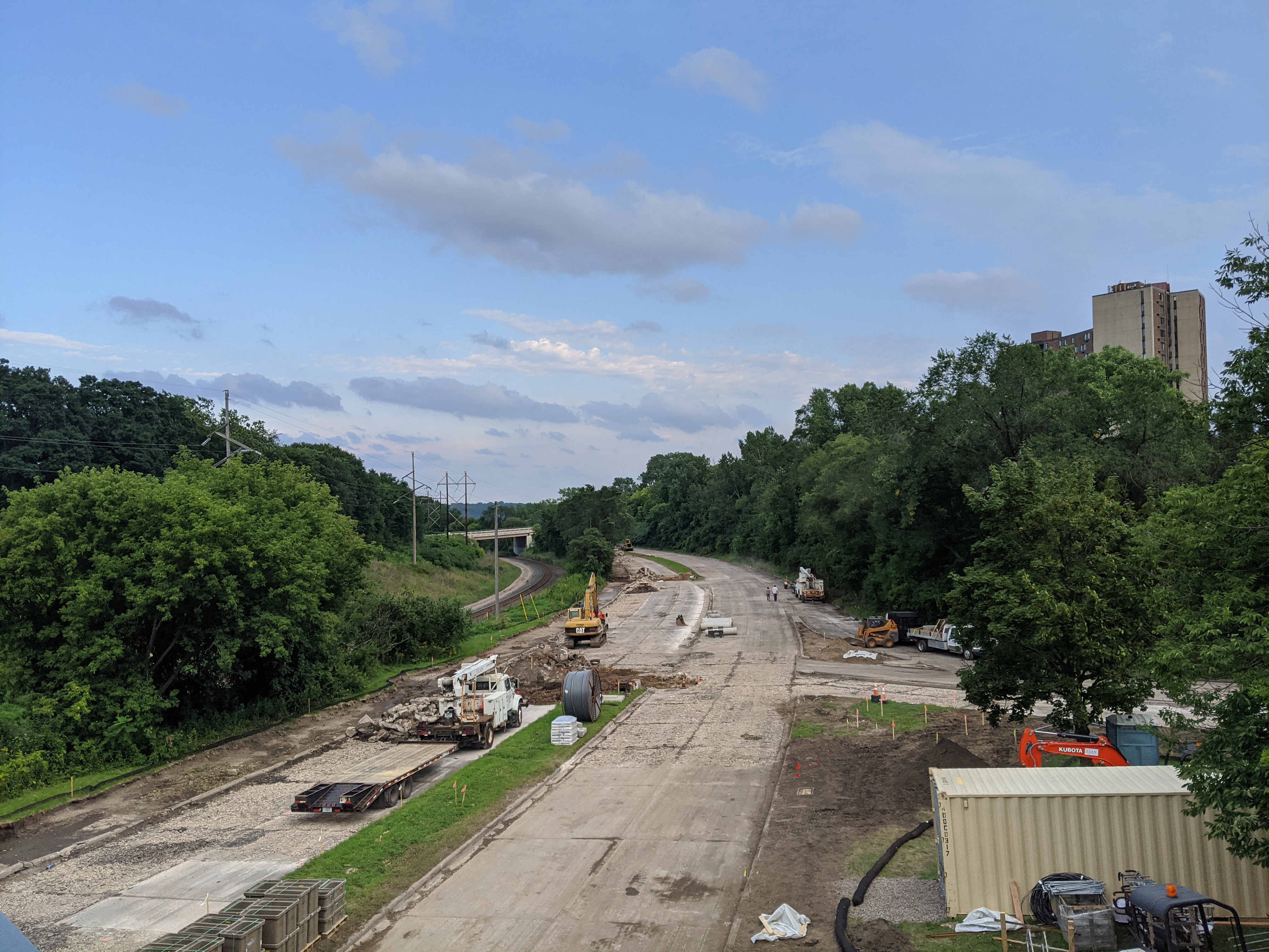 Ayd Mill Road under construction on 8.14.20. View from St. Clair overpass. Concrete road cut and rubbilized process underway. Trucks and other equipment in construction area.