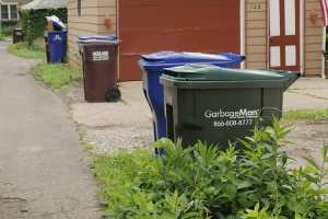 Picture of a Saint Paul alley with different garbage carts and recycling carts