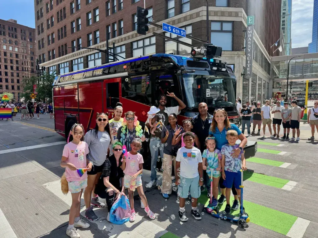 SPRWS employees pose with community members during 2025 Minneapolis Pride Parade