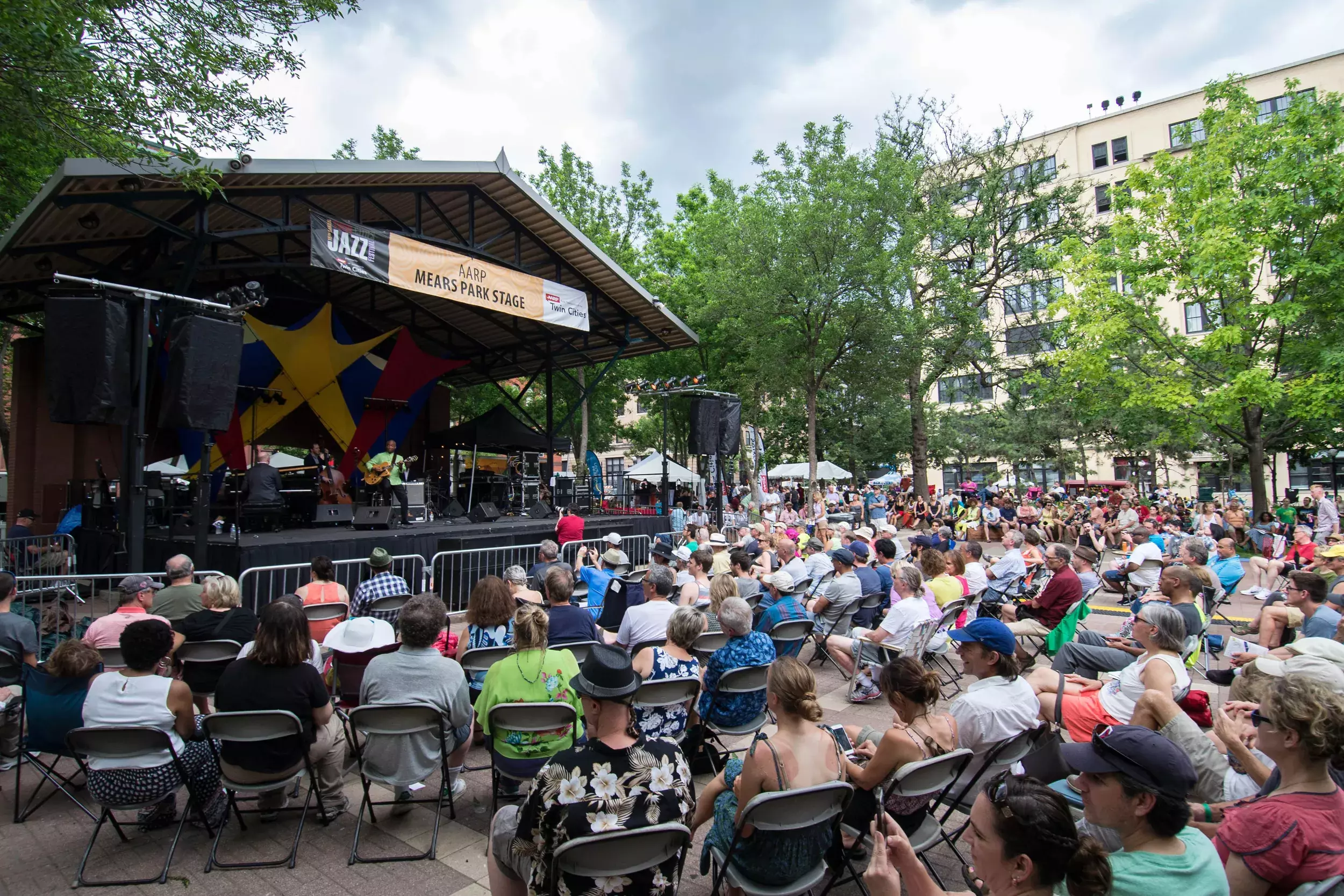 Large crowd listening to music in Mears Park 