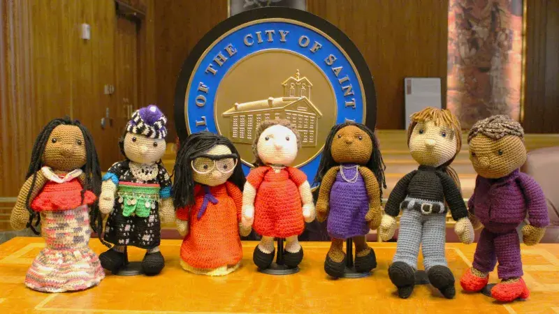 seven crocheted dolls she made of the members of the St. Paul City Council