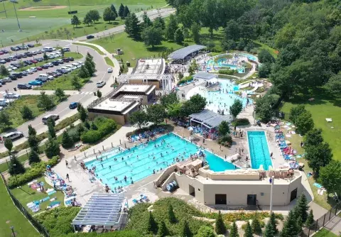 Drone image of a busy Como Regional Park Pool during the summer