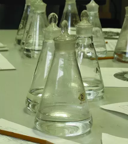 Bottles and paper forms on a table during taste and odor panel meeting