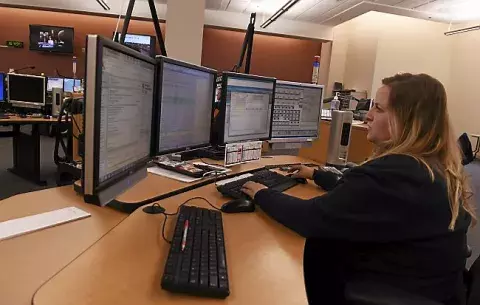 Ramsey County Emergency Dispatcher at her desk