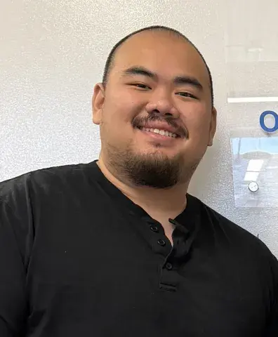 A man smiles for a picture.