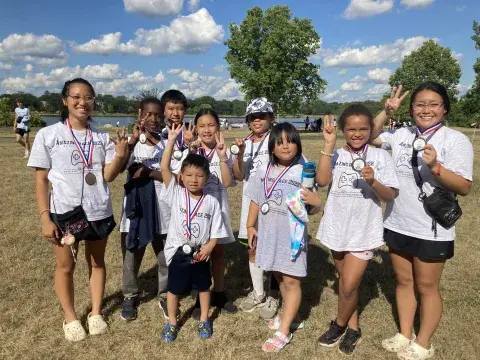 Amazing Race team with medals_Lake Phalen