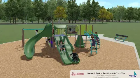 Playground with green slides, climbing features, a bench, an accessible entry.