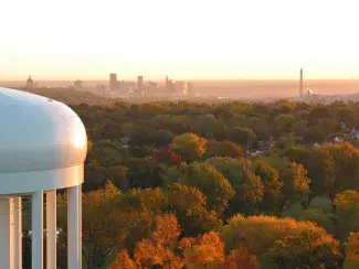 View of a water tower with Saint Paul skyline in the distance