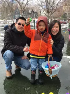 Family finding hidden eggs at a spring event