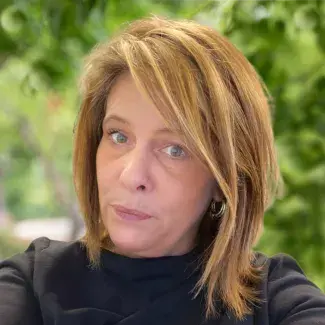 A woman poses for a photo