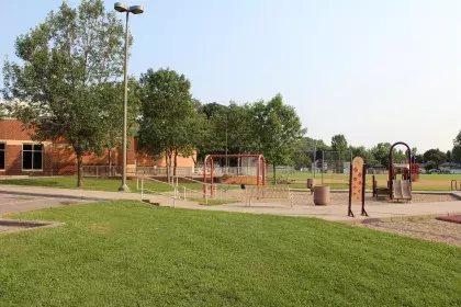 Hazel Park Recreation Center outside play area with rec center in back
