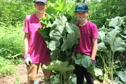 Kids holding Burdock