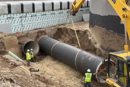 Setting 72 inch water pipes during construction of new McCarrons water treatment plant