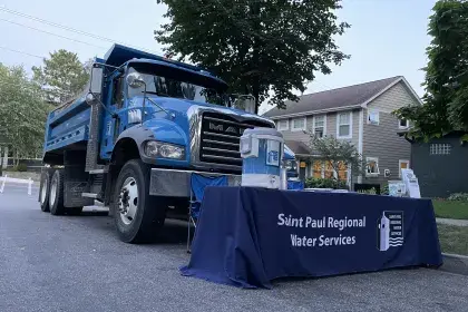 SPRWS branded booth in front of company truck