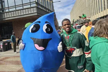Willy Water poses with Saint Paul Mayor Melvin Carter at 2025 St. Patrick's Day Parade