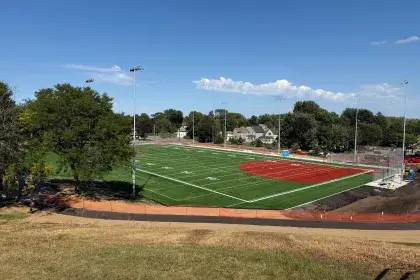 View of artificial turf athletic fields from a hill. 