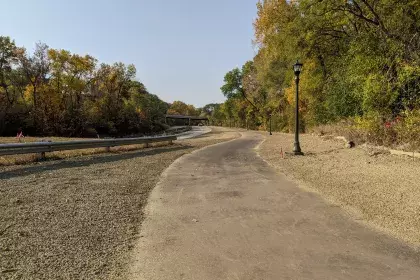 Photo of Ayd Mill Road construction as of 10.10.20. Photo shows the new light poles along the trail as seen north bound from Jefferson Avenue.